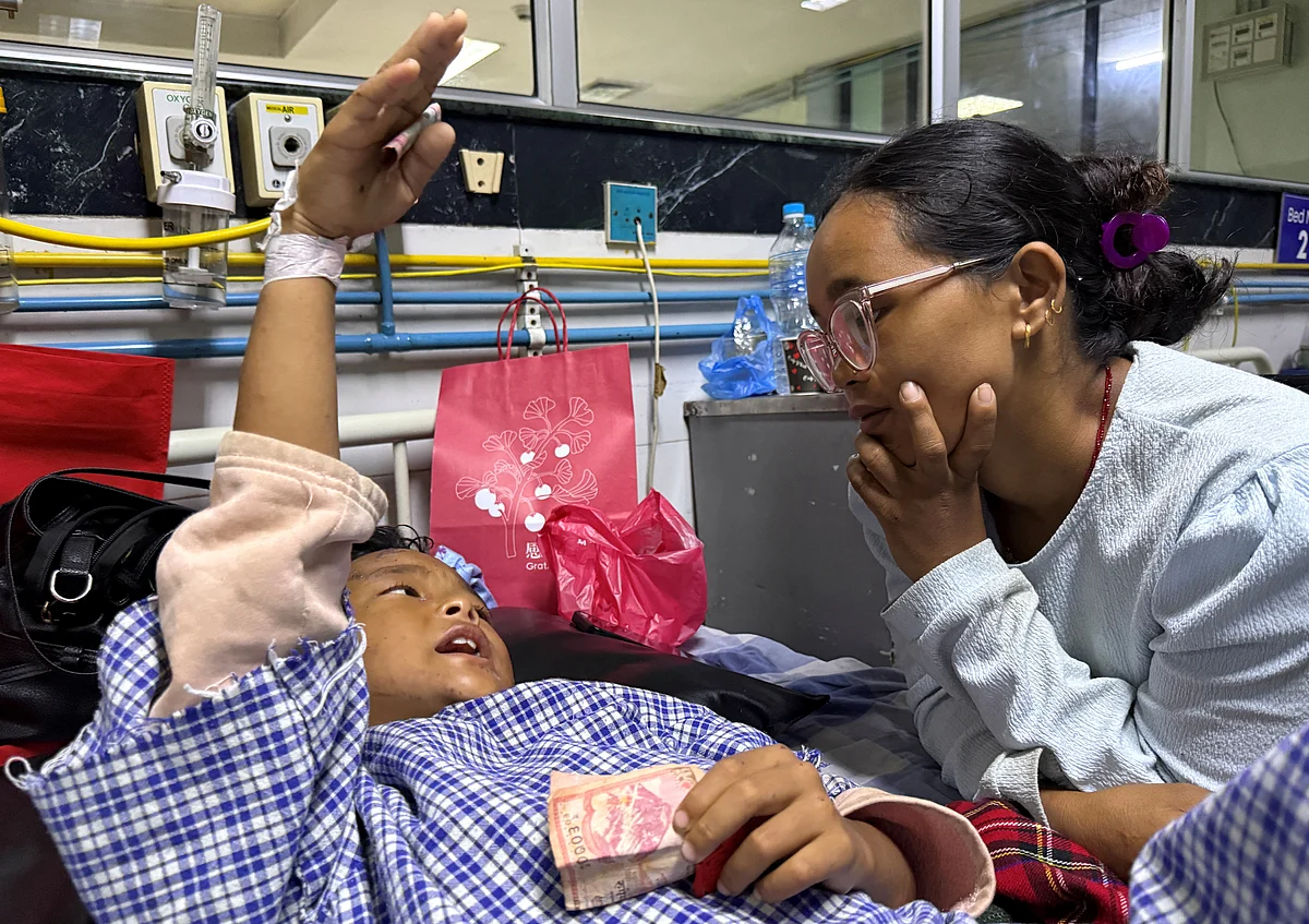 Nepal floods: Mother reunited with 8-year-old who climbed trees to survive