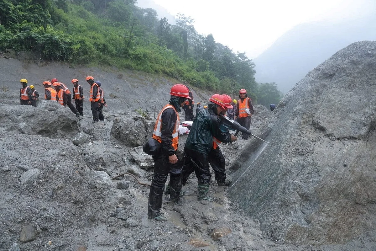 Rescuers battle floods and debris as Himalayan disaster death toll nears 800