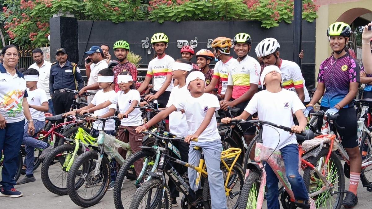 Children ride bicycles blindfolded in Vijayapura