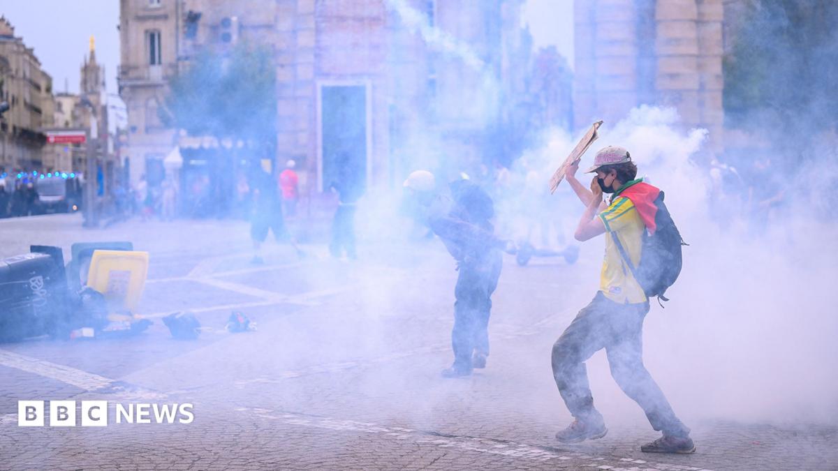 France school protests: Police fire tear gas at crowds as tens of thousands join school demonstrations – BBC